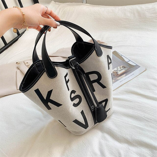 Women's canvas tote bag with letter print design, stylish and spacious, from BACKUPMYFILESNOW® designer collection.