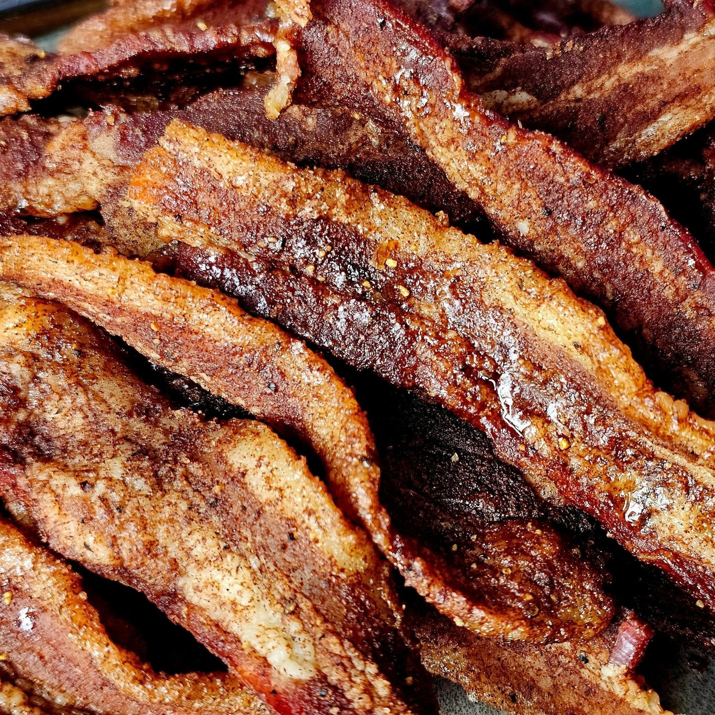 Cedar Valley Cuts Brown Sugar Cinnamon Bacon Jerky, 2oz snack-sized premium bacon jerky with sweet and savory flavor.