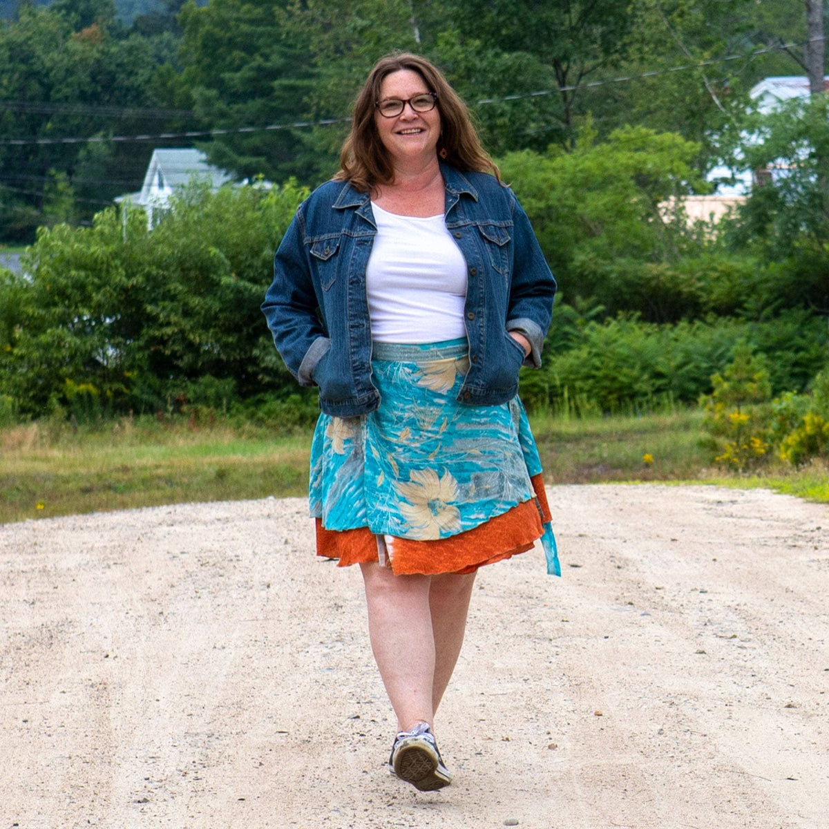 Knee-length mini sari wrap skirt in warm tones by Darn Good Yarn, featuring vibrant fabric and traditional Indian-inspired design.