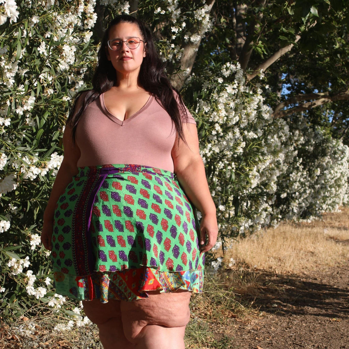 Knee-length mini sari wrap skirt by Darn Good Yarn in warm tones, showcasing vibrant fabric and traditional wrap style.