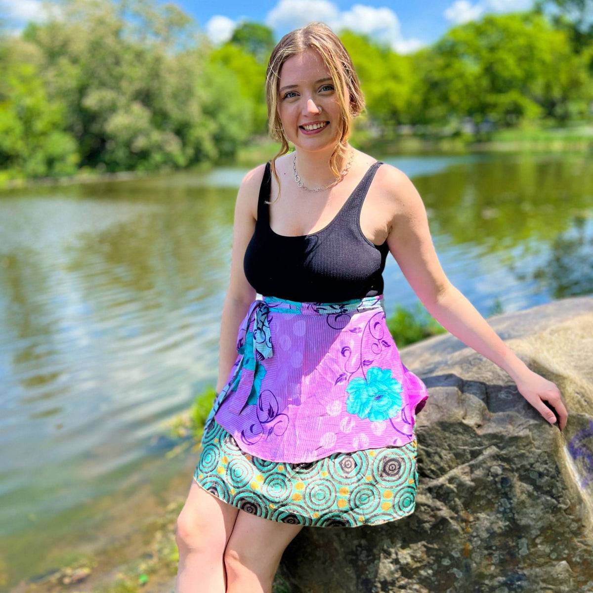 Knee-length mini sari wrap skirt by Darn Good Yarn in warm tones, featuring vibrant fabric and traditional wrap style.