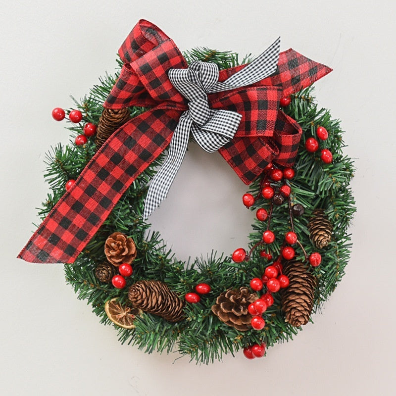 Christmas garland bow door hanging with festive red and green decorations for windows and doors