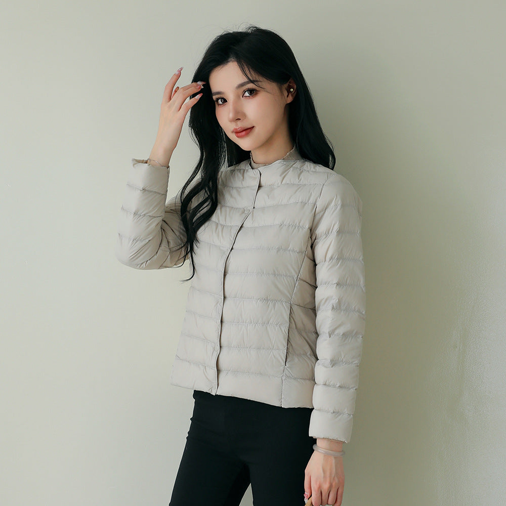 Women's lightweight white duck down jacket with quilted design and zip front