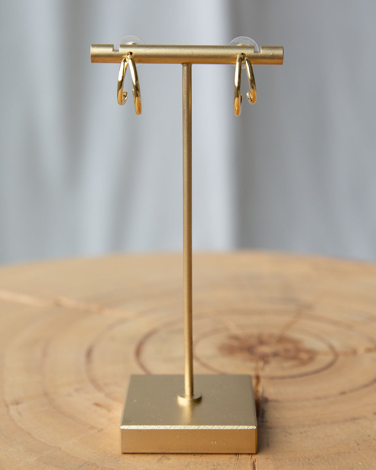 Gold double hoop earrings from Downeast featuring layered hoop design and polished finish.