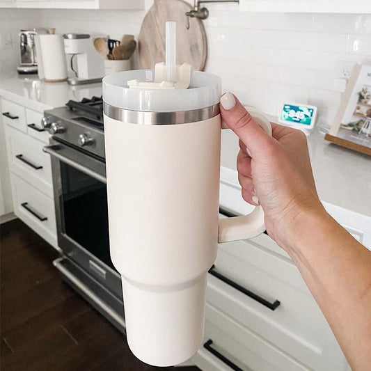 EasyOptionXY 1200ml stainless steel travel mug with handle, straw, and thermal insulation for coffee and drinks.