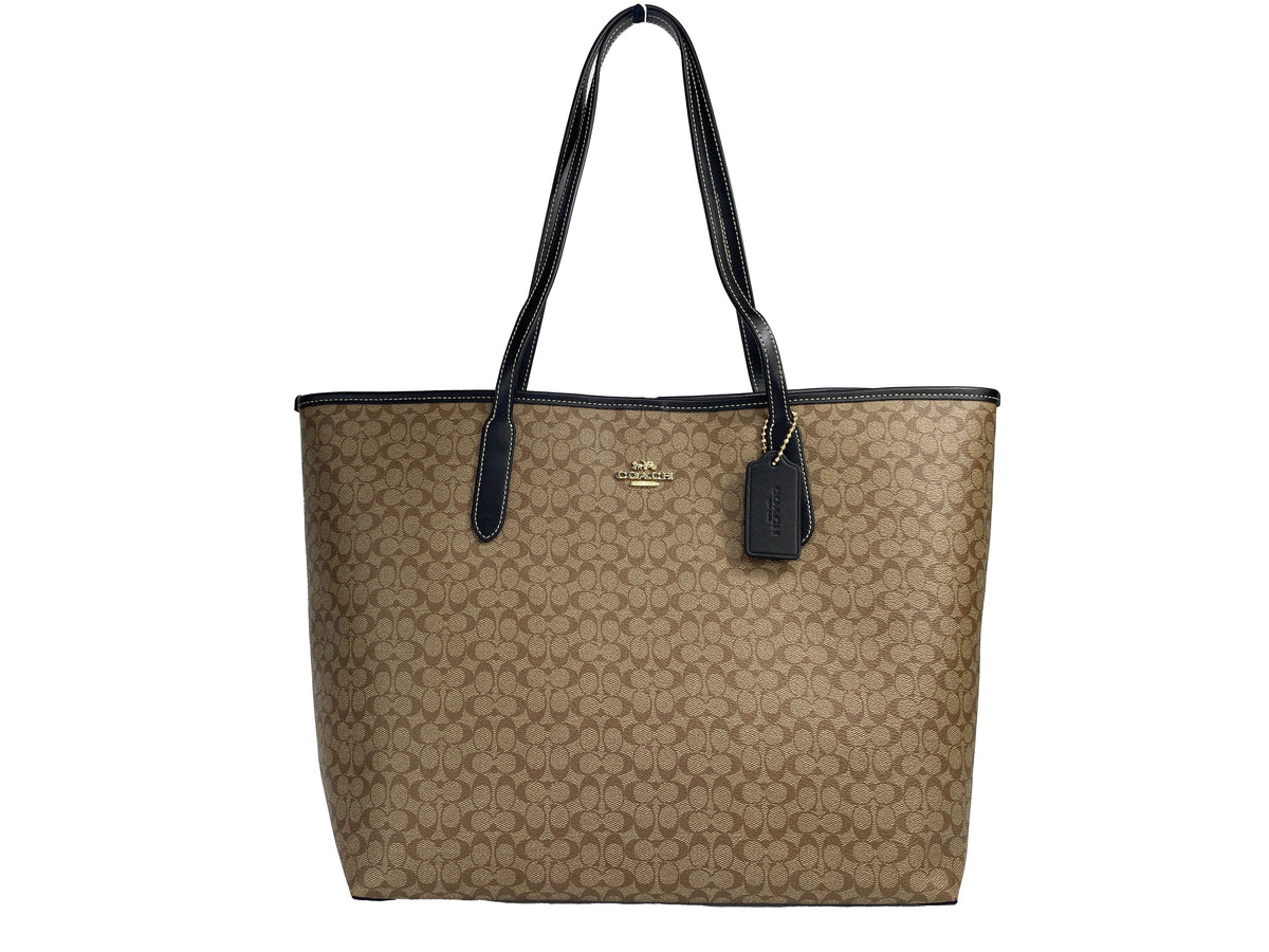 Coach CJ942 khaki Signature City Tote Bag with leather handles and spacious interior, stylish for everyday use.