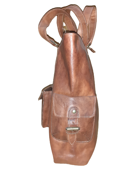 Handmade women's shoulder bag with a strap, featuring stylish craftsmanship and detailed leather design.