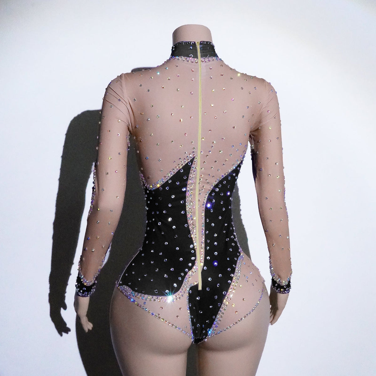 Women's rhinestone mesh patchwork jumpsuit with sparkling embellishments and sheer panel details