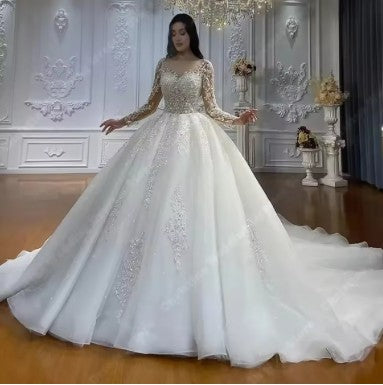 Luxurious Regal Sparkle Ball Gown Bridal Dress by EdleessFashion with intricate embellishments and flowing skirt, perfect for weddings.