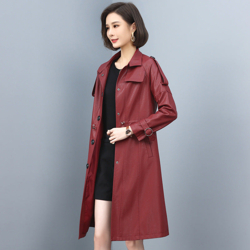 Women’s leather trench coat with turn-down collar, drawstring waist, solid color, and long sheepskin design