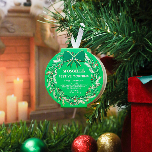 Spongellé Festive Morning Sweet Ambrosia holiday wreath body wash infused buffer with lush greenery and holiday-themed accents.