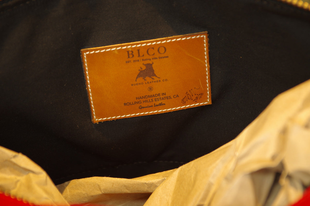 Large luxury leather duffle bag by Bueno Leather Co. with sturdy handles, spacious interior, and handcrafted detailing.