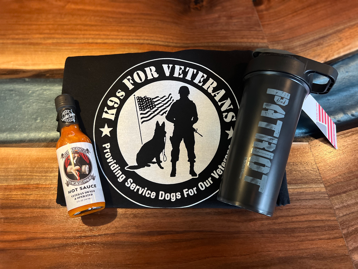 Corspice K9 for Vets gift pack with assorted dog care products, including treats and accessories, displayed in a gift box.