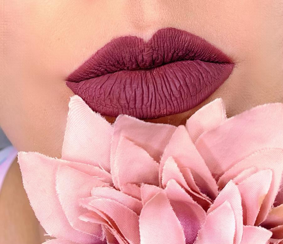 Matte liquid lipstick in shade 18 by BACKUPMYFILESNOW®, featuring smooth application and vibrant color on a neutral background.