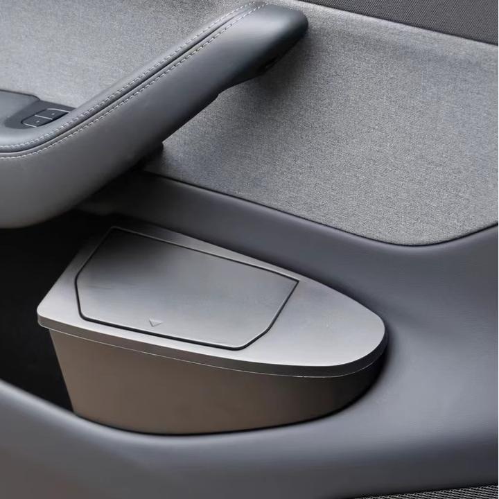 Two Tesery Model Y front door trash can organizers in Juniper color, designed as storage boxes for Tesla Model Y.