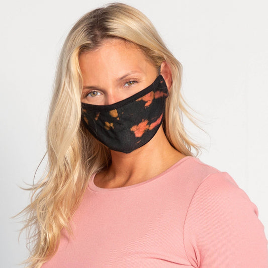 Set of three tie-dye face masks by GreaterGood, protective fabric masks with ear loops and colorful patterns.