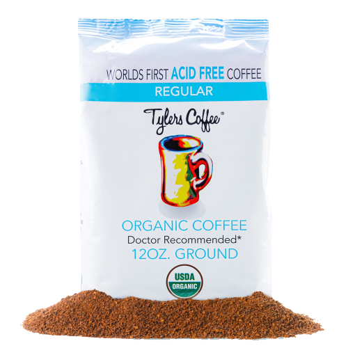Ground acid-free coffee from Tylers Coffees, showing freshly ground coffee beans in a clear container.
