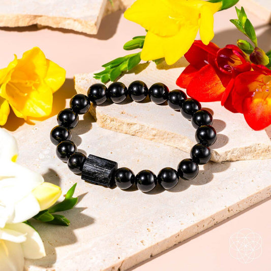 Black Obsidian and Tourmaline bracelet from Conscious Items, featuring polished stones on a comfortable elastic band.