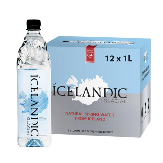 Six 1L bottles of Icelandic Glacial Natural Spring Alkaline Water, clear bottles with mountain branding and water inside.