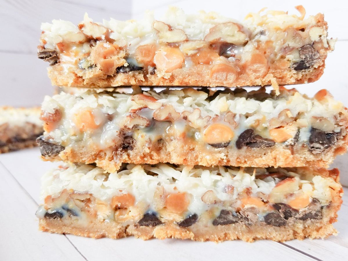 Assorted Let's Get Baked Artisan Desserts Magic Bars with chocolate, caramel, and coconut in a close-up view