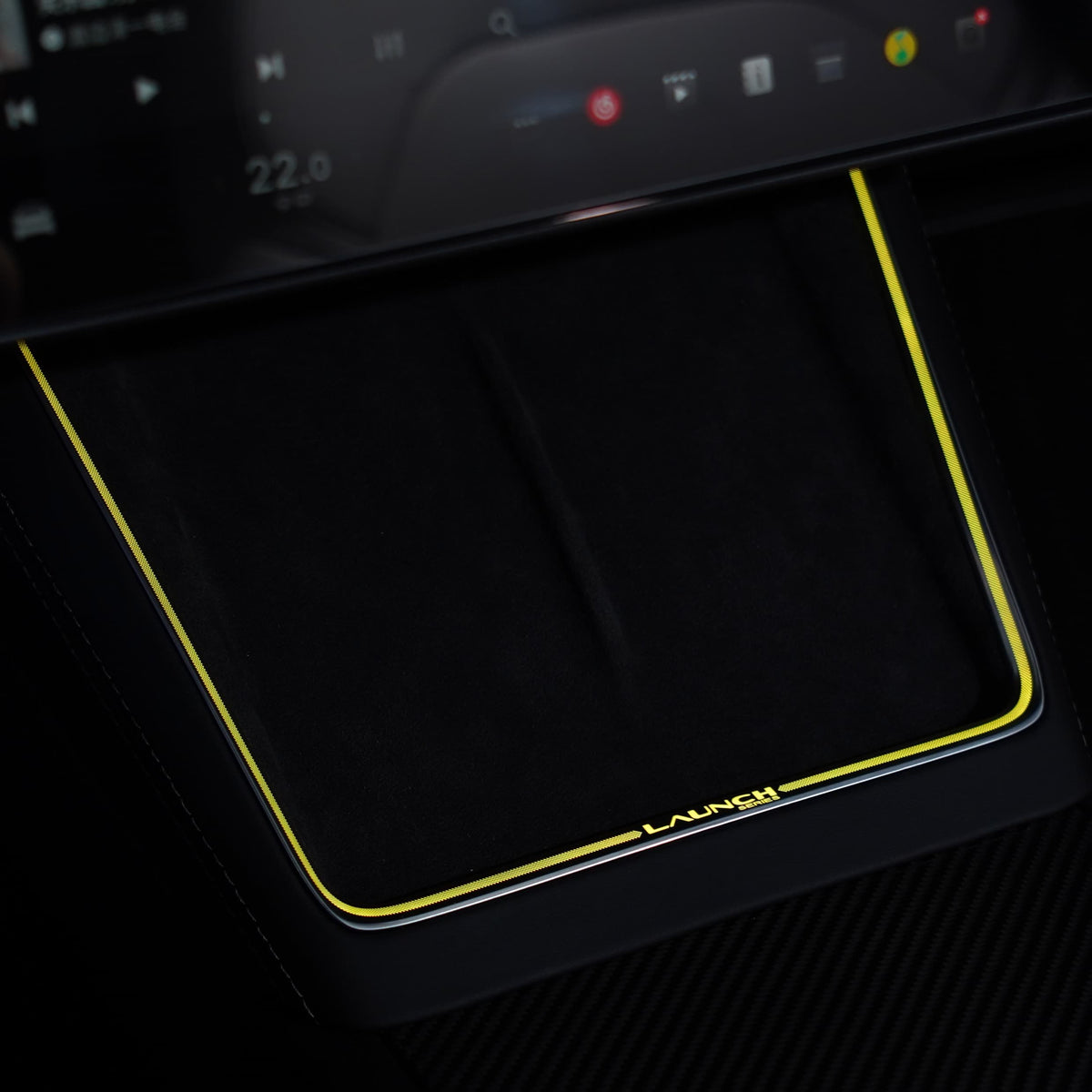 Laser-carved ambient light for Model Y Juniper with wireless charging port by Tesery, illuminating the interior with stylish LED lighting.