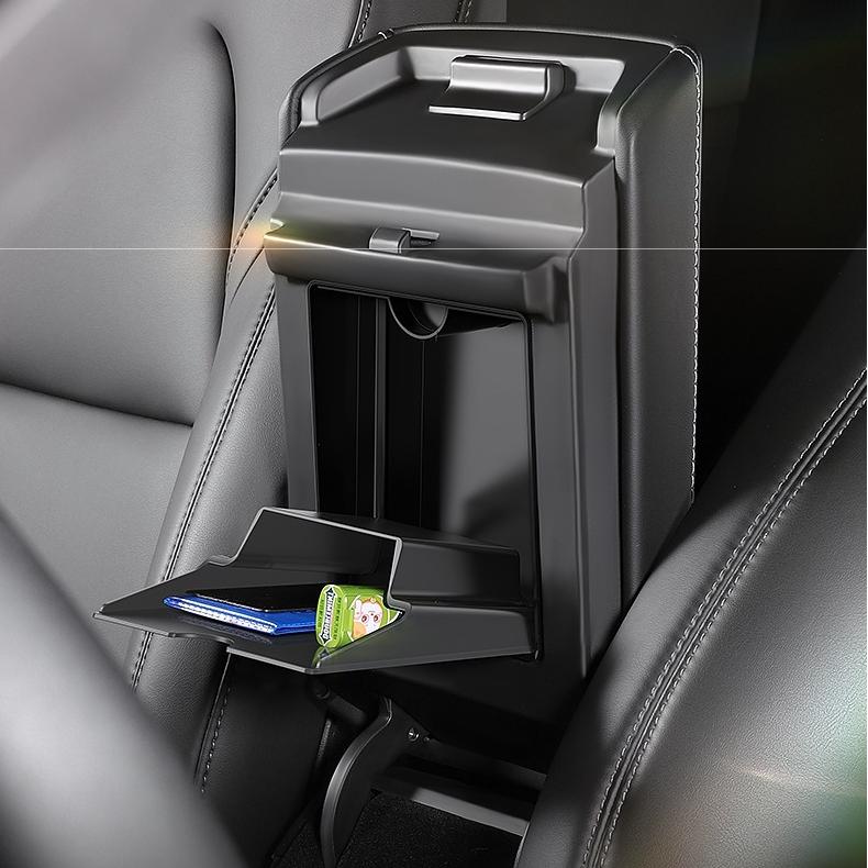 Magnetic hidden center console storage box for Tesla Model Y Juniper and Model 3 Highland, designed for organized interior storage.