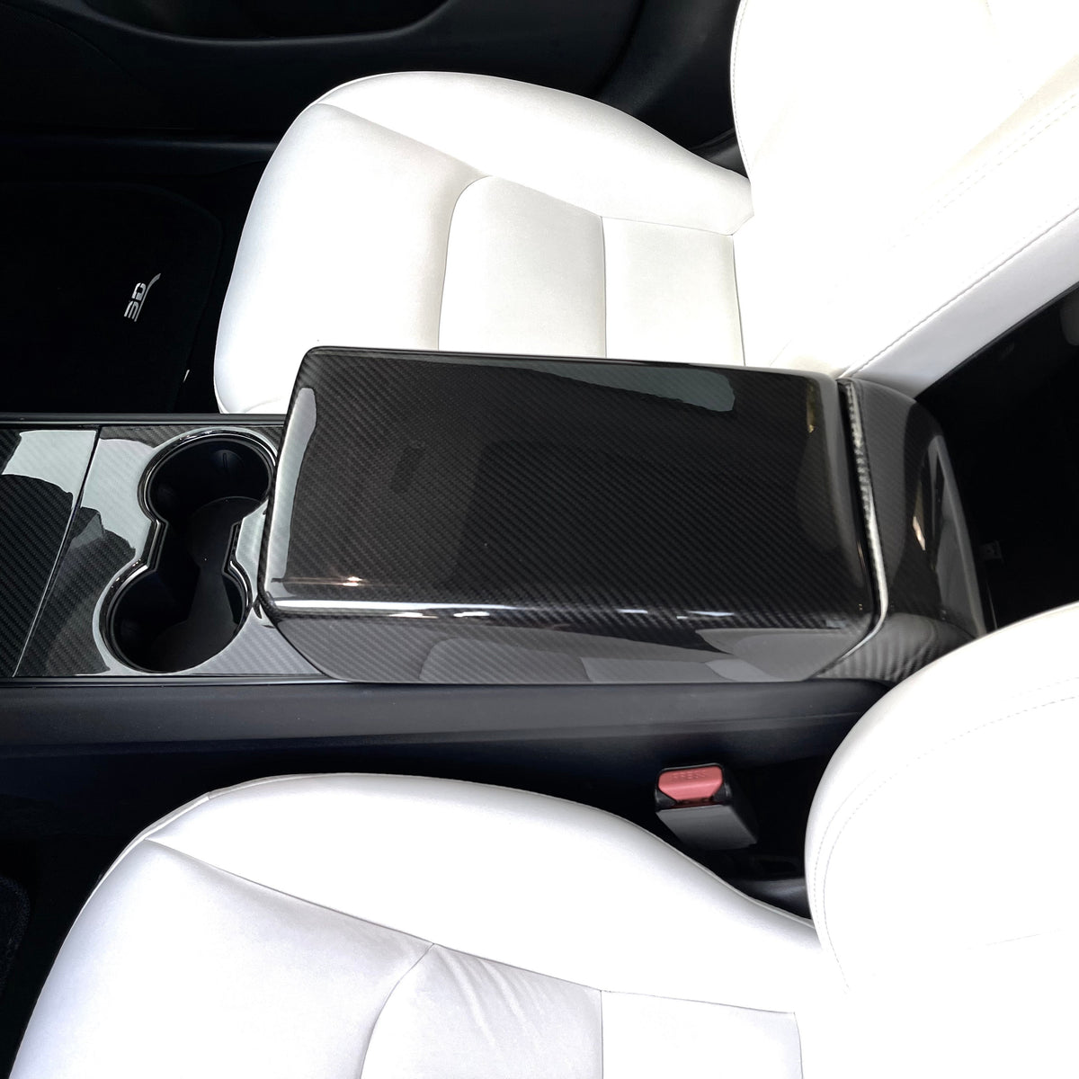 Tesla Model Y and 3 armrest cover in sleek dry carbon fiber, designed for interior enhancement and stylish protection.