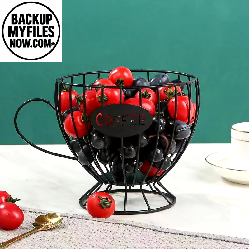 Black mug-shaped coffee pod holder with large capacity for organizing coffee pods and creamer containers.