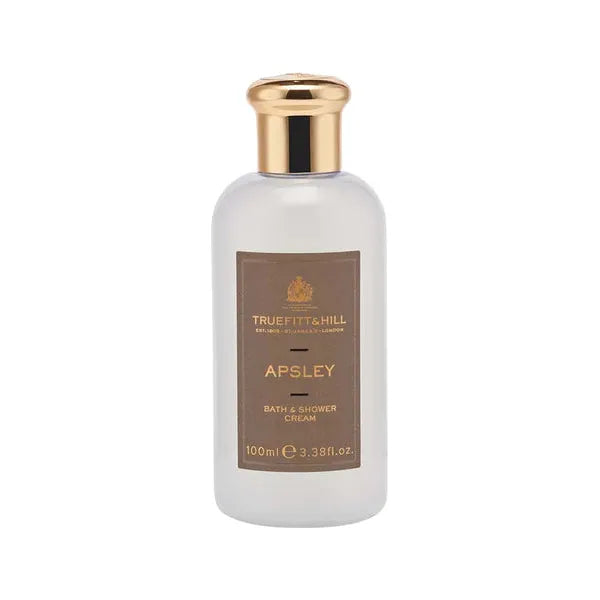 Truefitt & Hill Apsley bath and shower travel cream, 3.38 oz, in a sleek white bottle with elegant branding.