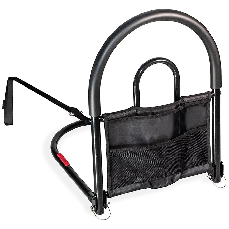 Pasteur Pharmacy Stander Bed Rail Advantage Traveler and Organizer attached to a bed, with safety rail and storage pockets visible.
