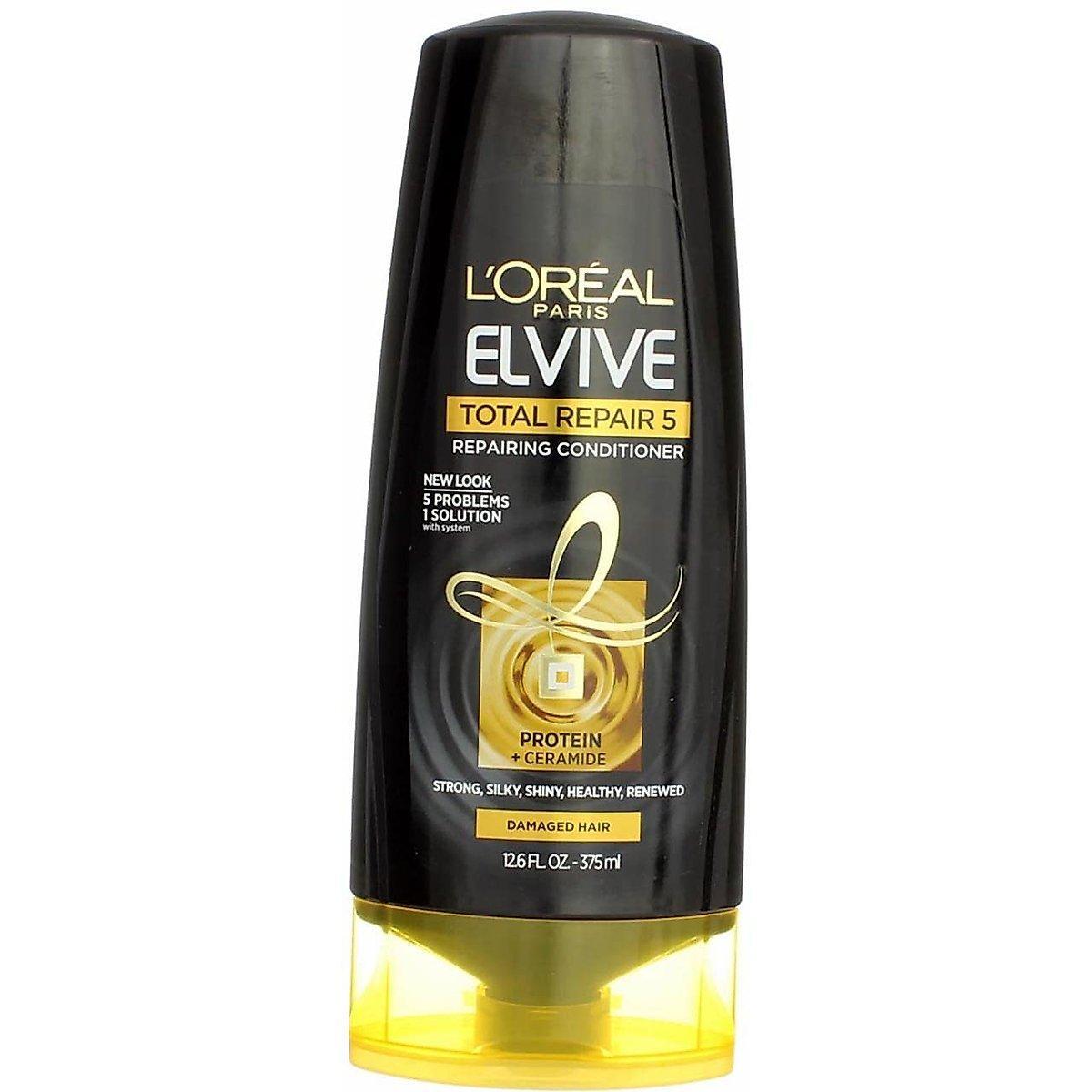 L'Oreal Paris Elvive Total Repair 5 repairing conditioner in 12.6 oz bottle, designed to restore damaged hair.