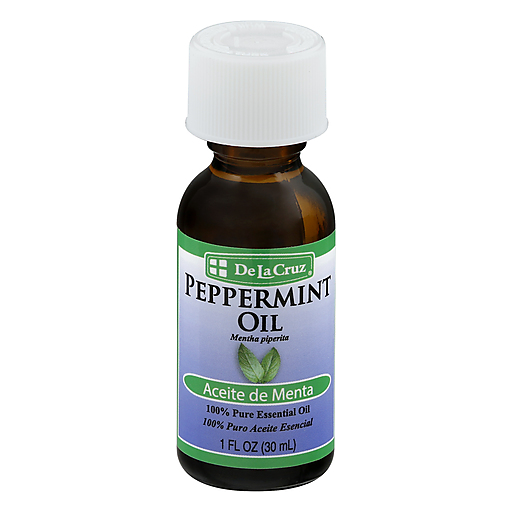De La Cruz 100% Pure Peppermint Essential Oil in a small glass bottle, used for cuticle care and aromatherapy, with peppermint leaves.