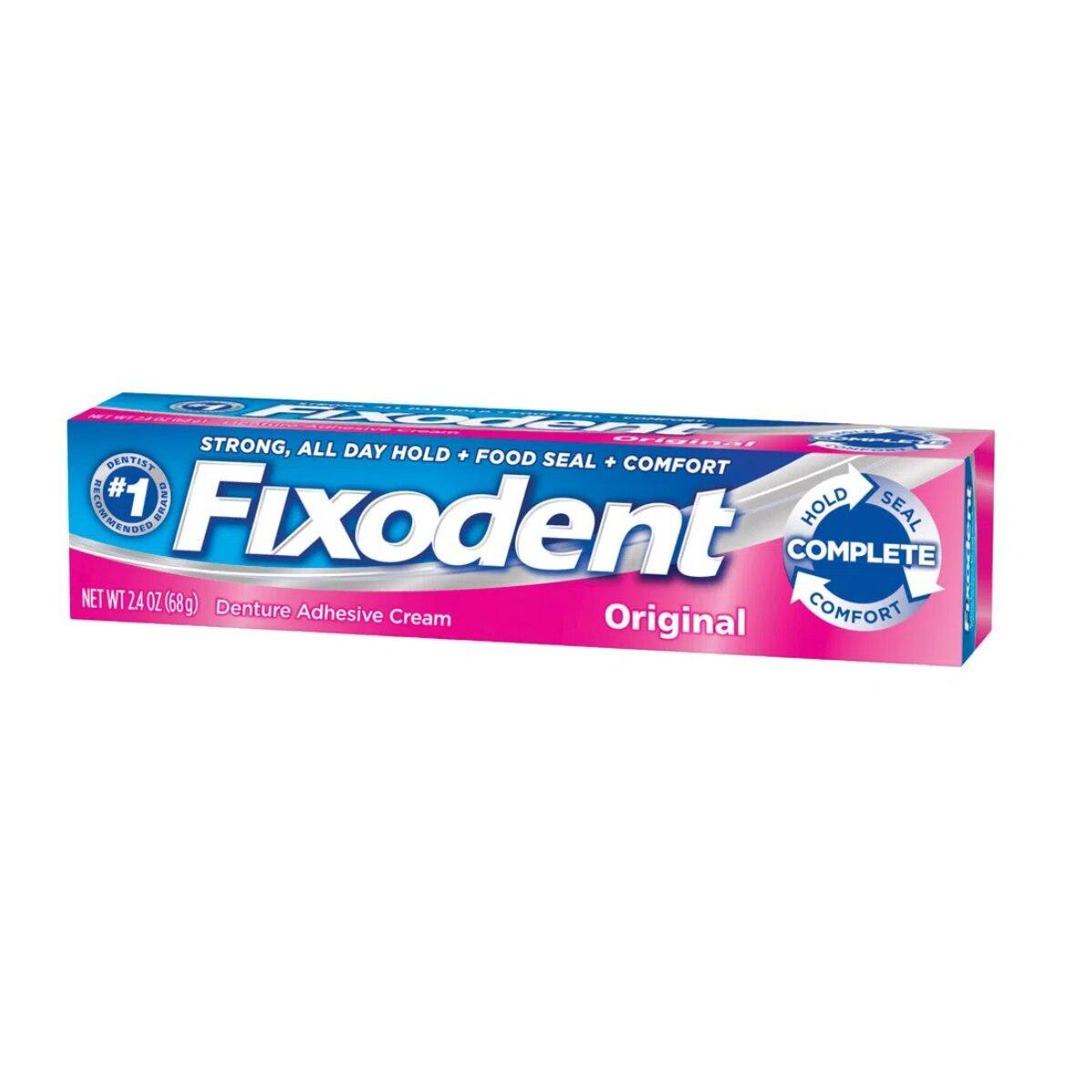 Fixodent Complete Original Denture Adhesive Cream in a 4-pack, 2.4 oz each, shown in a retail display with denture adhesive tubes.