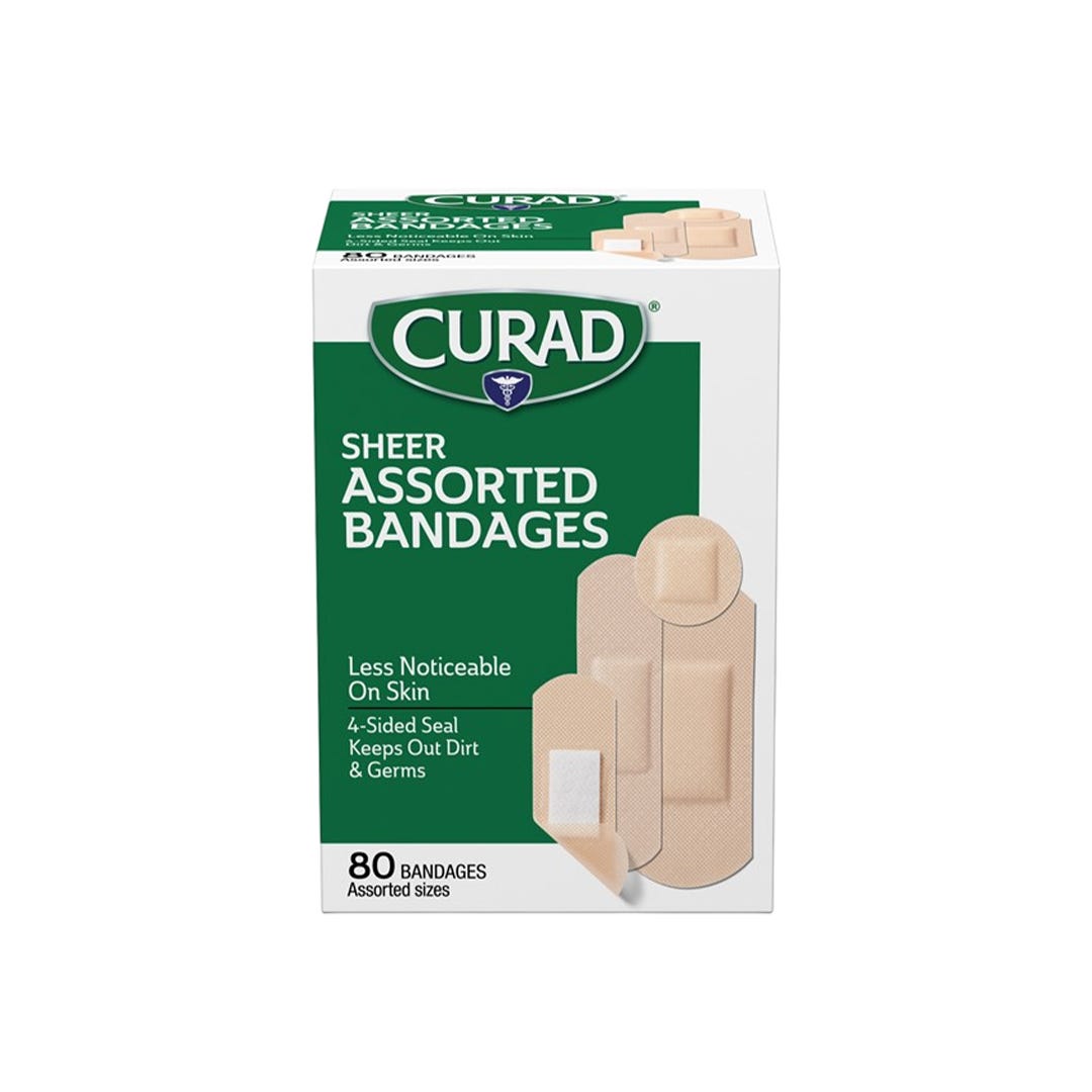 Assorted sizes of Pasteur Pharmacy Curad Sheer Adhesive Bandages for discreet wound protection, 80-count first aid supplies.