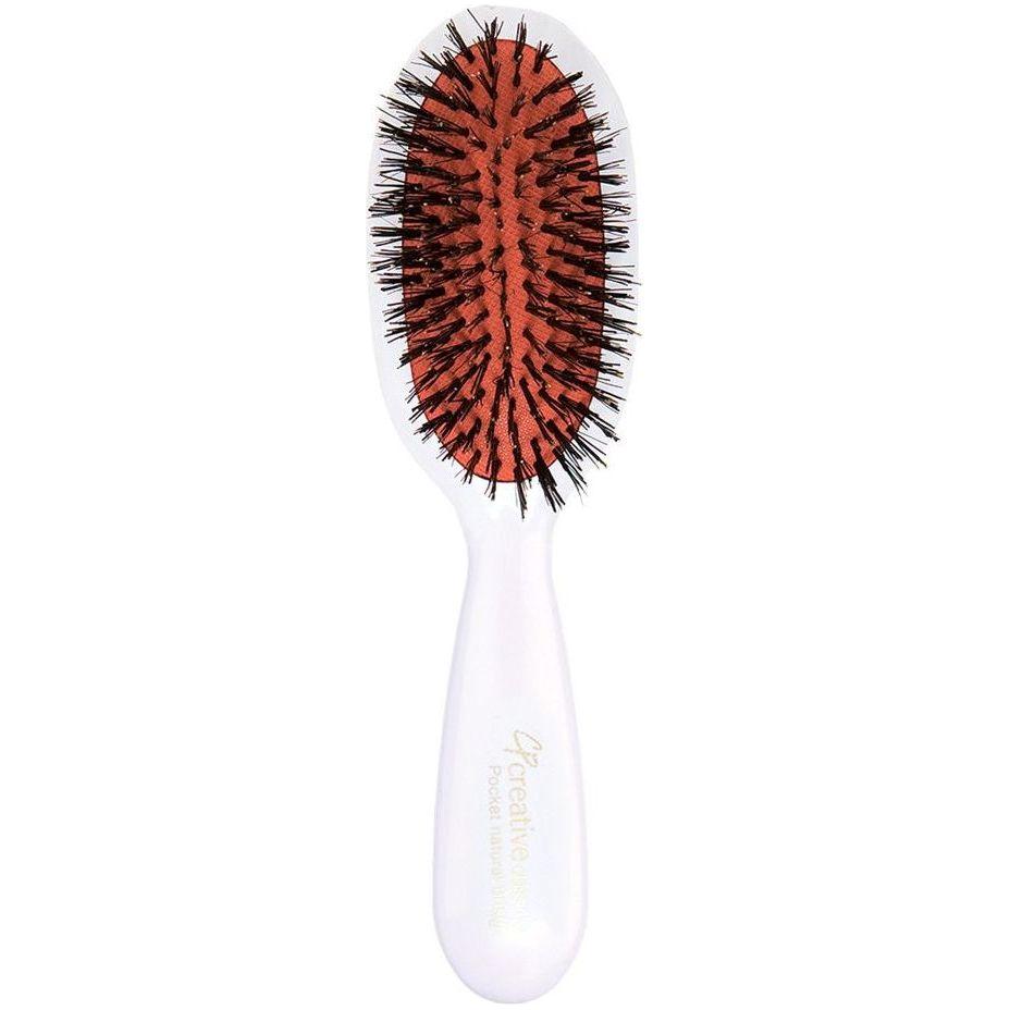 Classic white paddle hair brush with boar bristles from Pasteur Pharmacy, designed for gentle, effective hair detangling and smoothing.