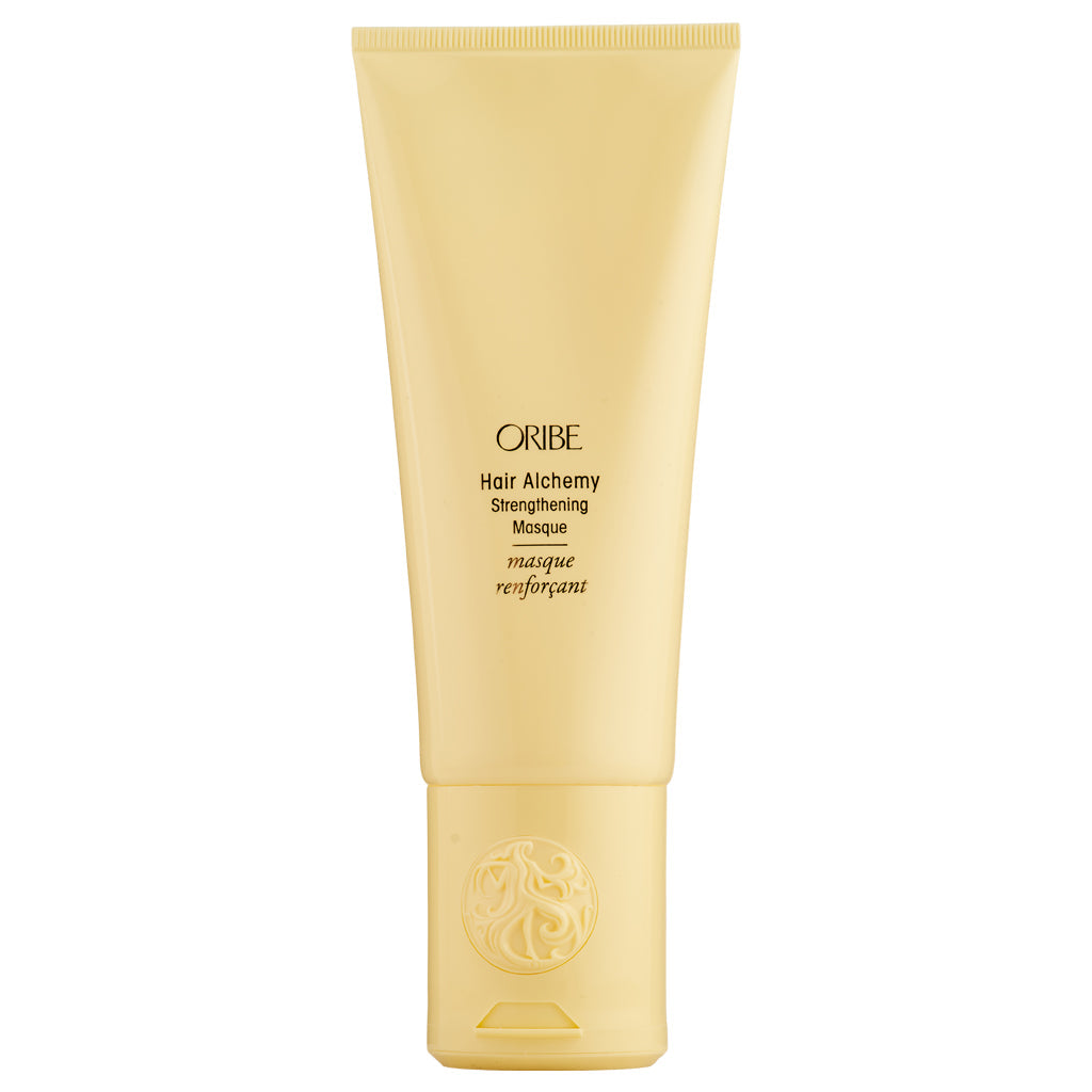 Oribe Hair Alchemy Strengthening Masque in a jar, designed to nourish and reinforce hair with a luxurious hair care treatment.