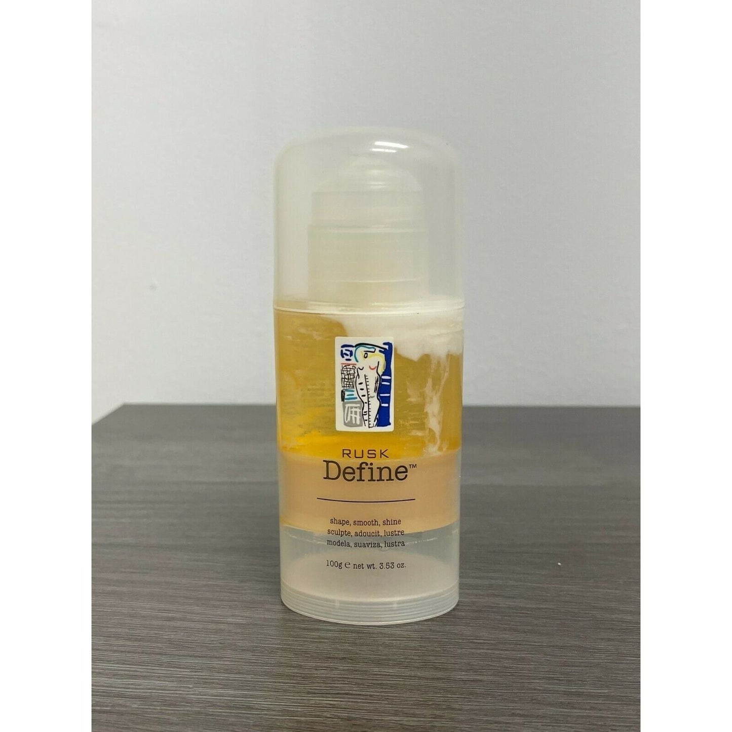 Rusk Define Shape Smooth Shine hair styling product in 3.53 oz bottle, ideal for shaping and adding shine to hair.