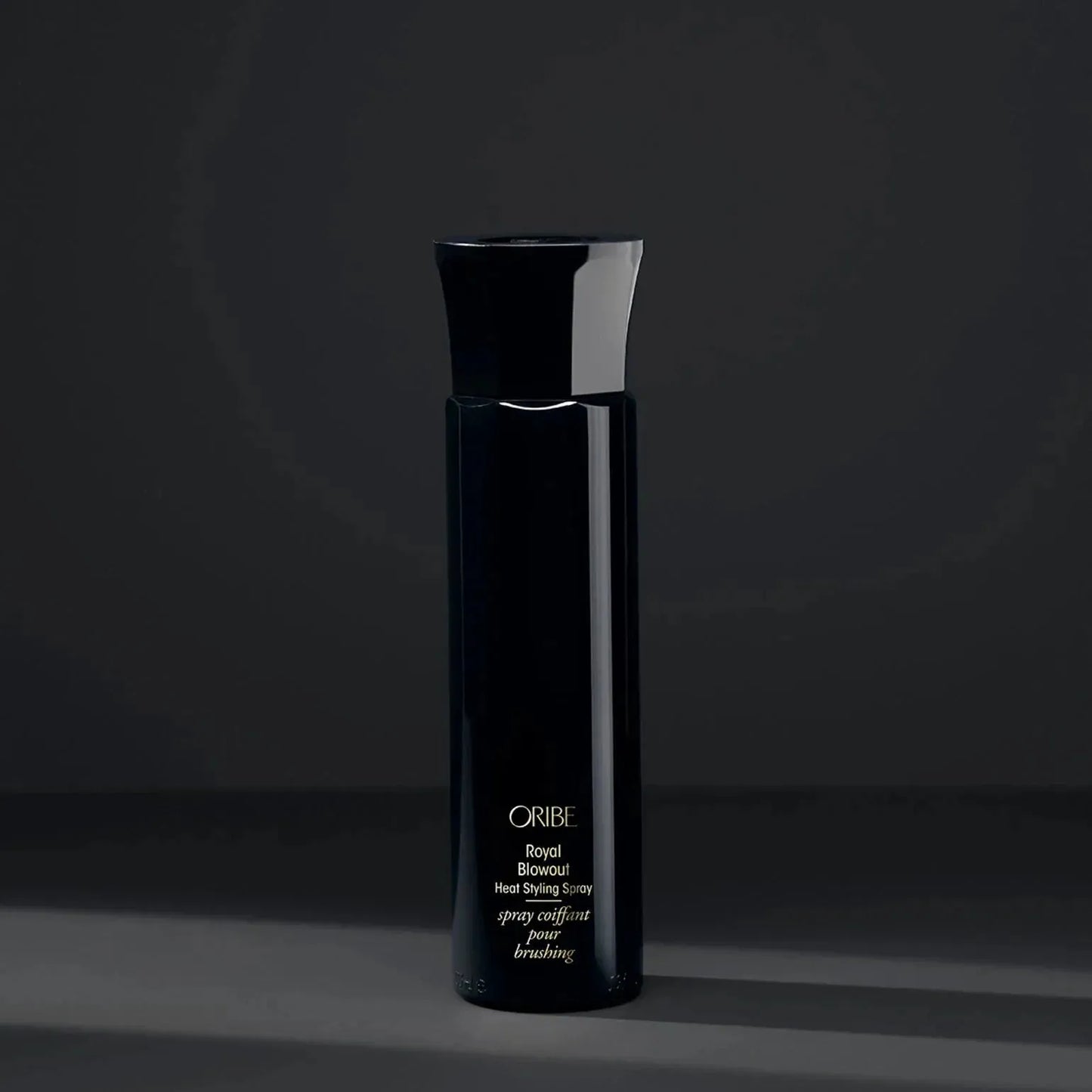 Oribe Royal Blowout Heat Styling Spray in 175ml bottle, a hair styling spray for smooth, shiny hair.