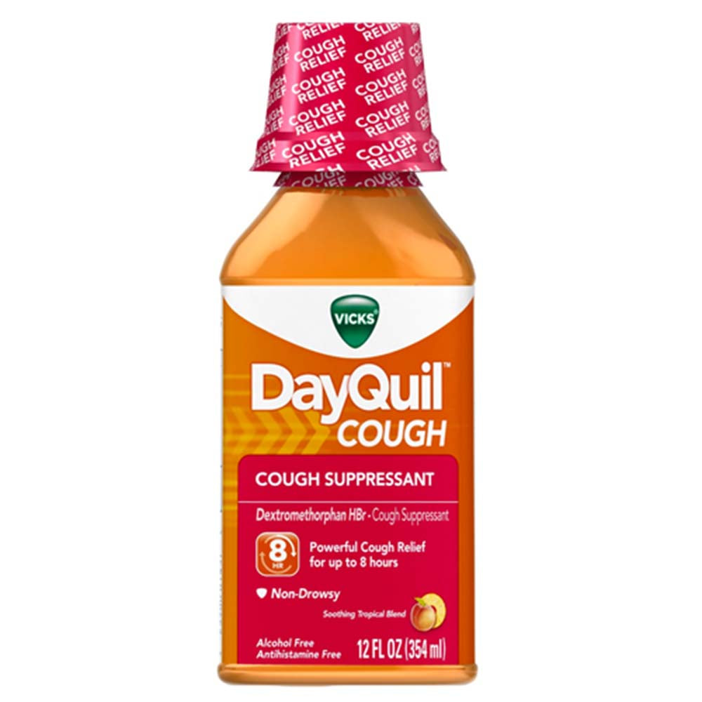 Vicks Cough Suppressant in soothing tropical flavor, 12 oz bottle, for cough relief, displayed on a health and beauty product shelf.