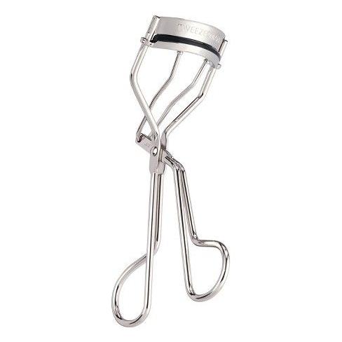 Tweezerman Lash Curling Eyelash Curler with black handle and curved metal clamp for shaping and curling eyelashes.