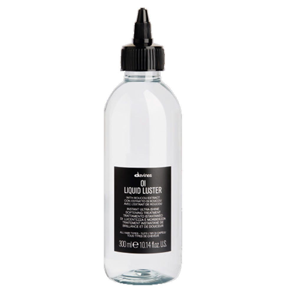 Davines Oi Liquid Luster in a clear bottle, showcasing its glossy liquid formula for hair shine and vitality.