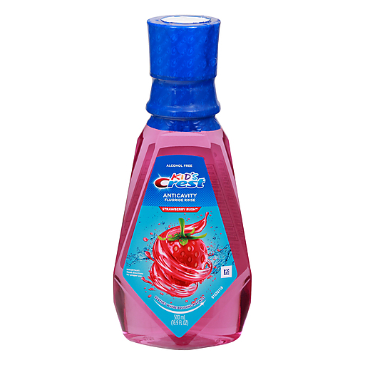 Crest Kids Strawberry Rush fluoride mouthwash in 16.9 fl oz bottle, alcohol-free, designed for children's oral hygiene.