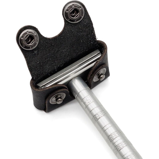 Black leather Henson Razor Head Cover by Pasteur Pharmacy, designed to protect and secure razor blades.