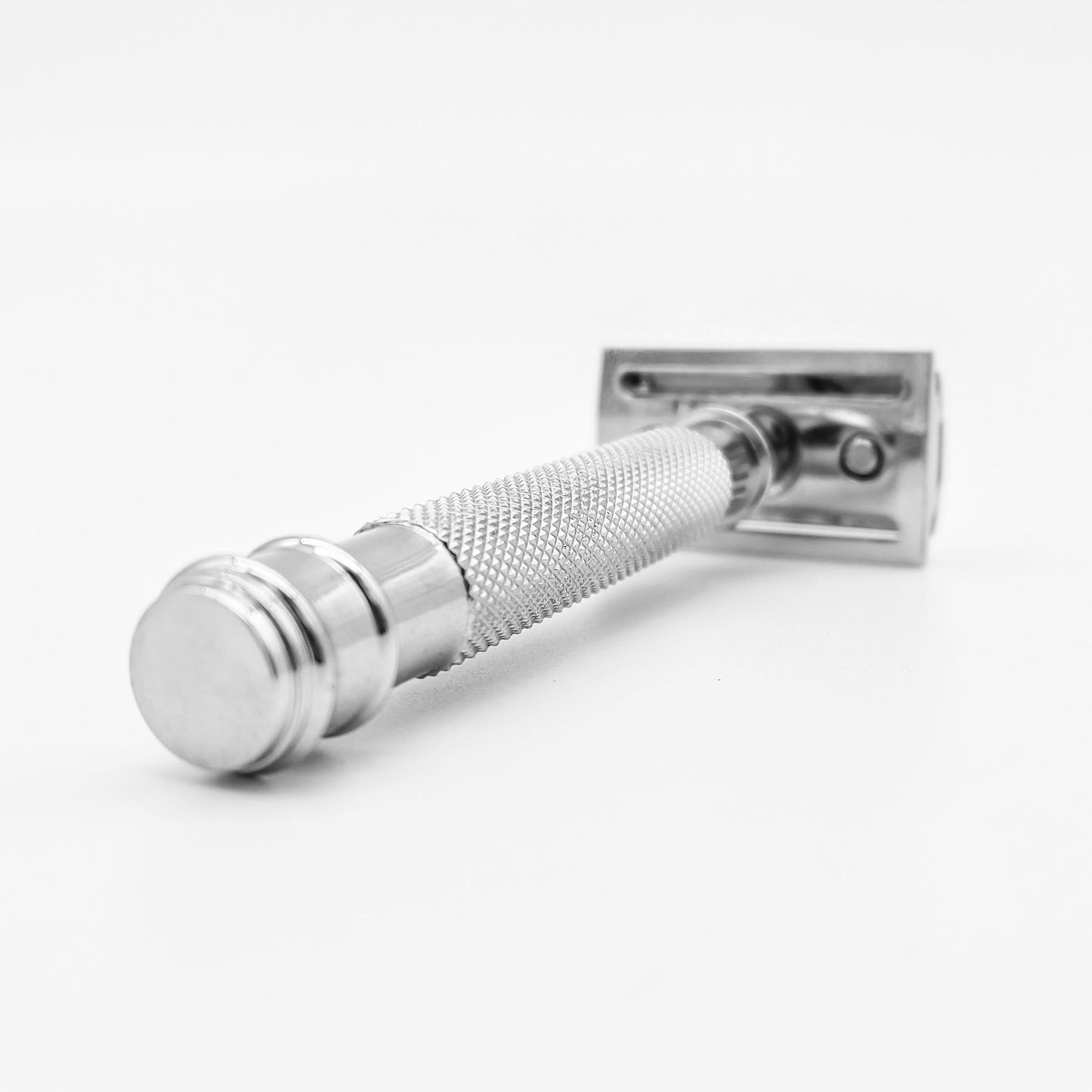 Dural Eyan chrome double edge safety razor with a black pouch, featuring a sleek handle and safety guard, by Pasteur Pharmacy.