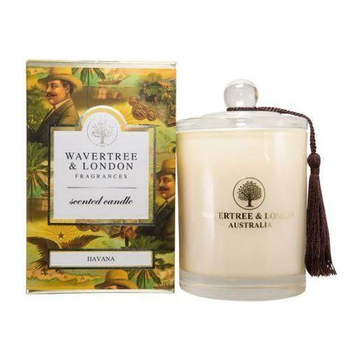 Wavertree & London Havana scented candle in a glass jar with a lit wick, showcasing warm, inviting candlelight.