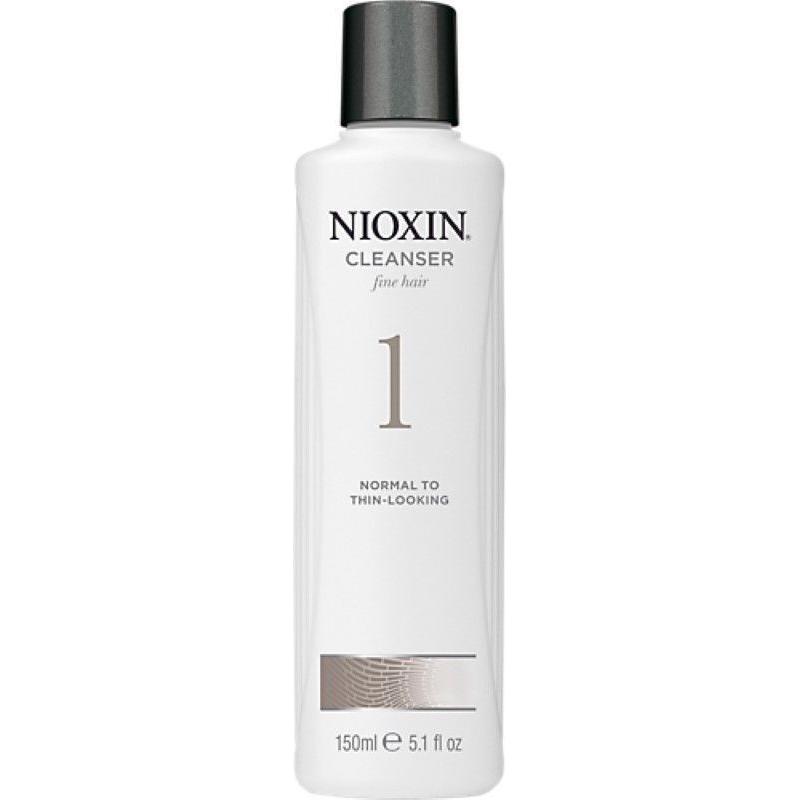 Nioxin System 1 Cleanser Shampoo in 5.07 fl oz bottle, designed for thinning hair, with clear shampoo liquid visible.
