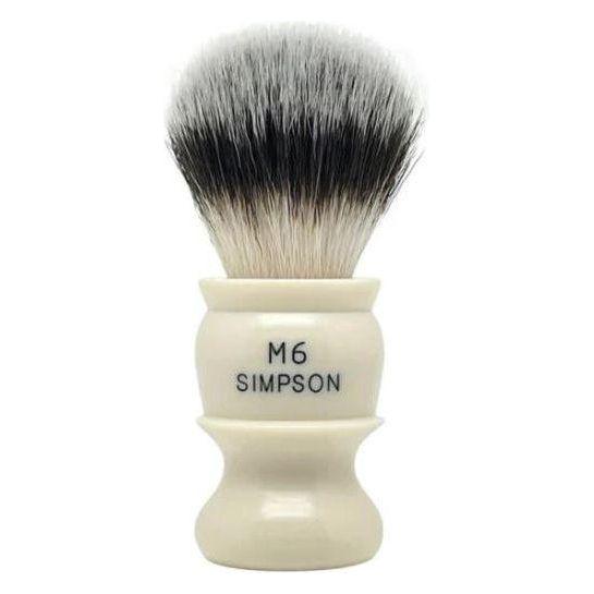 Simpson M6 Sovereign synthetic fibre shaving brush with white handle and dense bristles, designed for a close, comfortable shave.