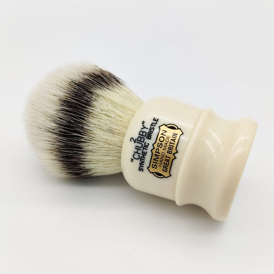 Simpsons Chubby 2 synthetic badger hair shaving brush with a sturdy handle, ideal for smooth, luxurious shaving experiences.