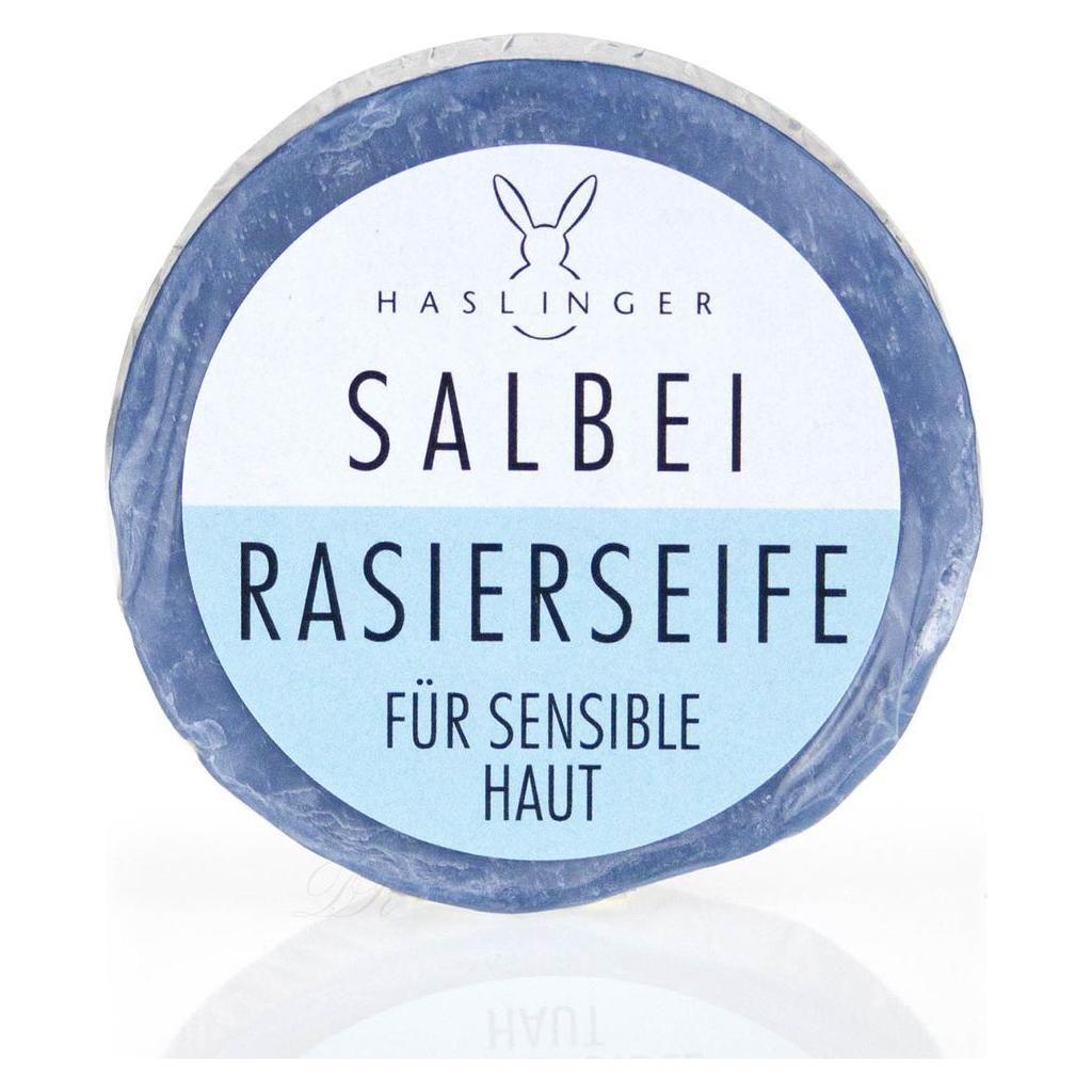 Haslinger Shaving Soap with Sage for Sensitive Skin, 60g, by Pasteur Pharmacy, showing a round soap with sage leaves in the packaging.