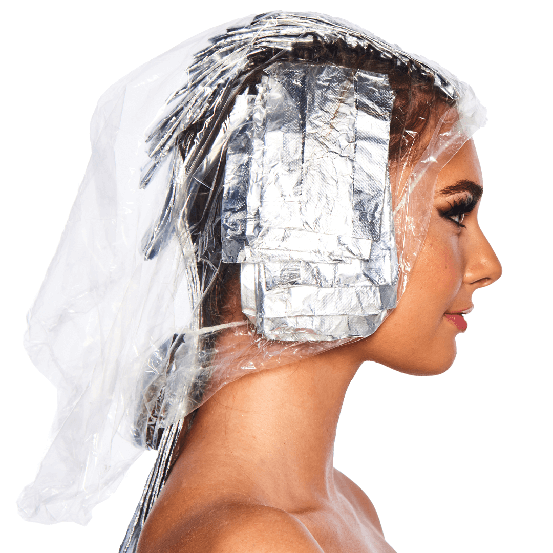 Clear disposable processing caps by Colortrak, designed for hair protection during treatments, shown in a close-up image.